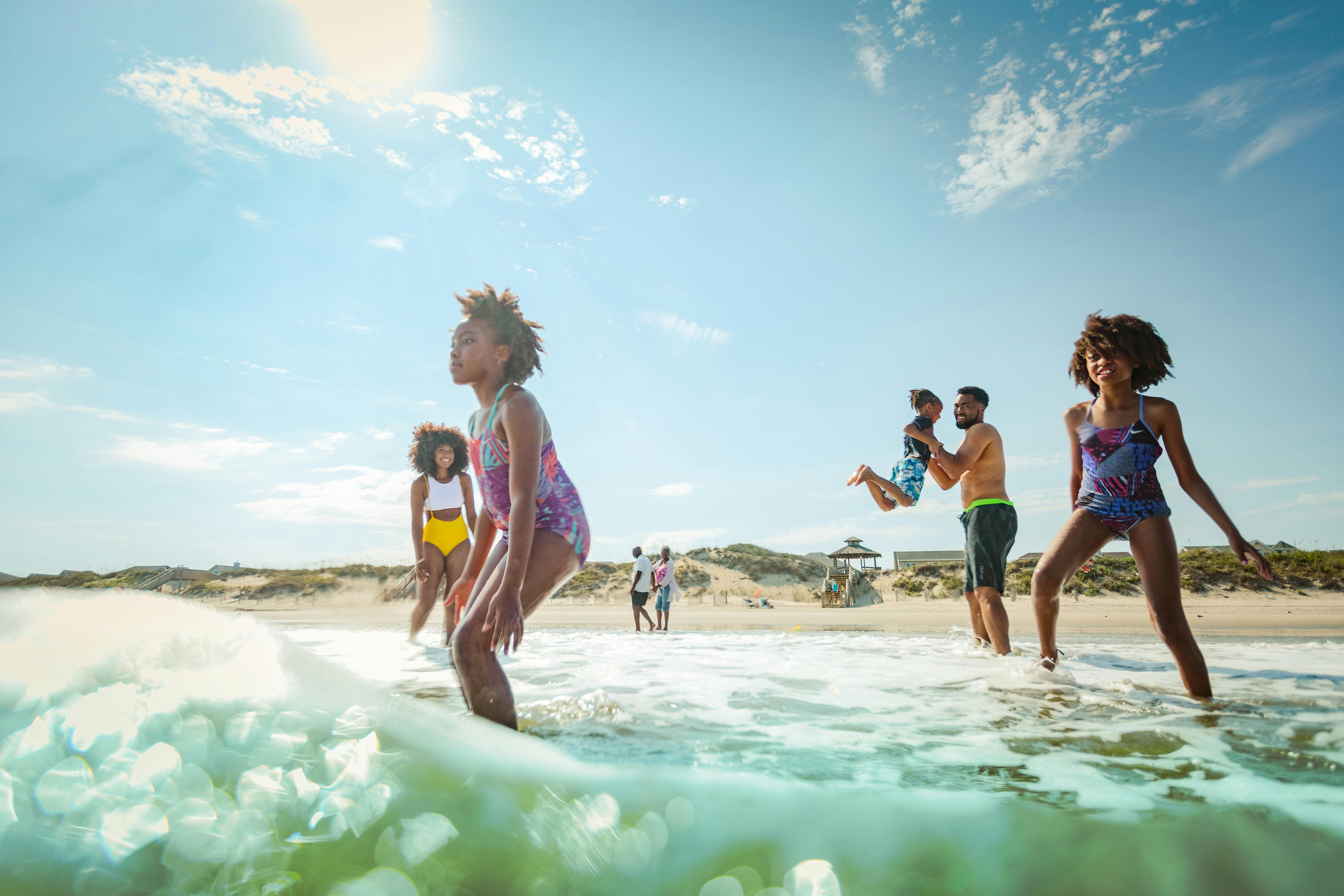 Family Jumping Waves Along Corolla Beach Sepia Edit 4 1