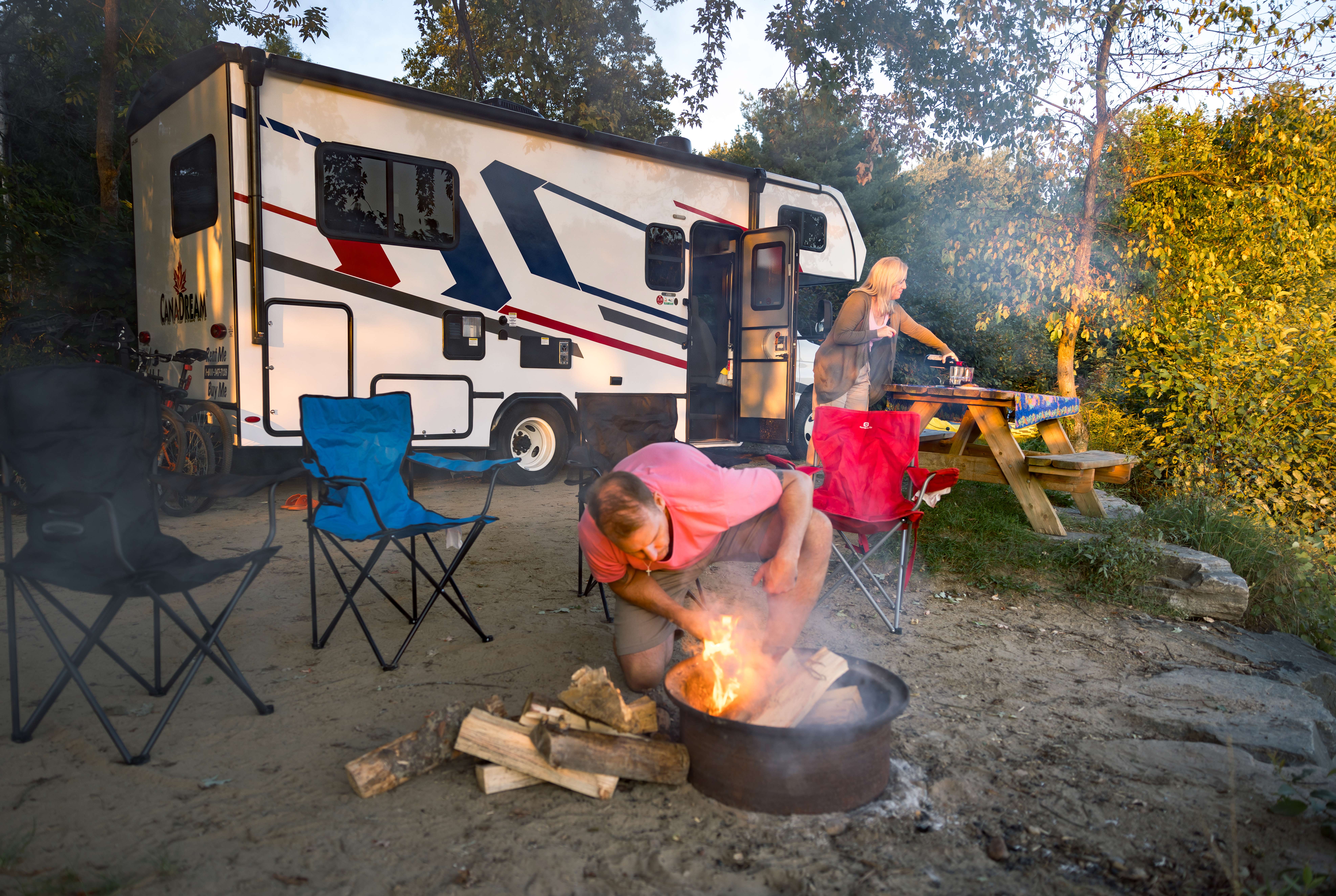 HDFahrzeugeCanadreamMHCCompact Motorhome MHC Canada couple by RV at campsite