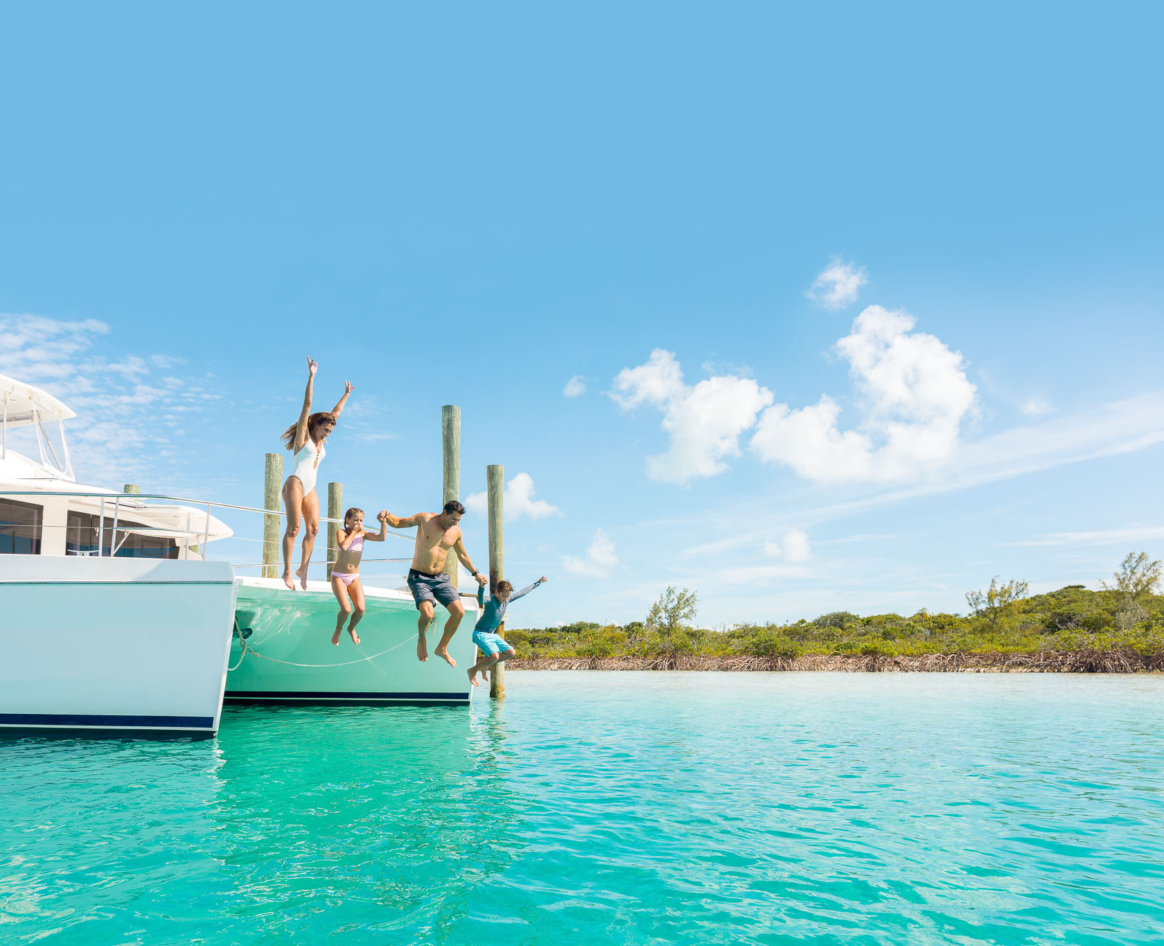 HDBahamasExumafamily jump in water