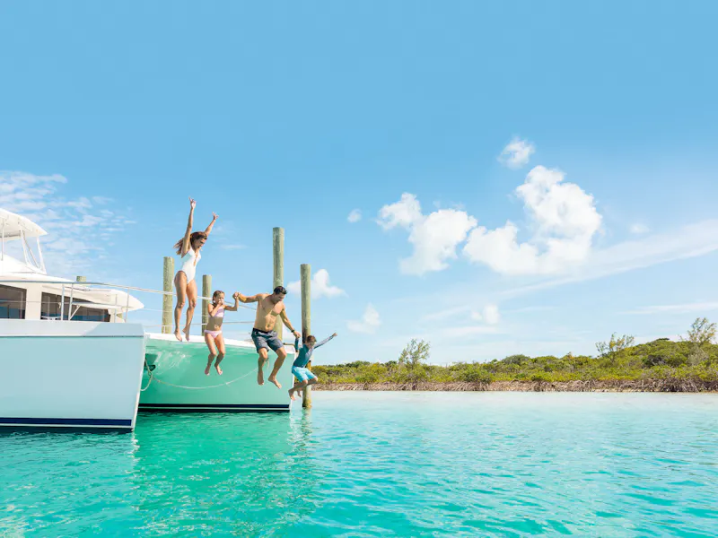 HDBahamasExumafamily jump in water